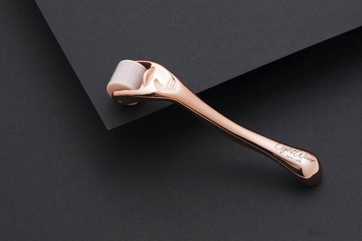Close-up of ergonomic foot scrubber dead skin remover in hand, gently gliding over dry, flaky heel skin